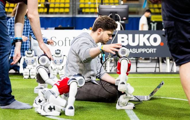 EINDHOVEN - A technician programs the robots during a practice day in the run-up to the World Cup for Robots: RoboCup 2024. Universities and technology companies from all over the world show what their robots can do in various disciplines. ANP IRIS VAN DEN BROEK netherlands out - belgium out  Copyright: xx x503647664x originalFilename: 503647664.jpg
