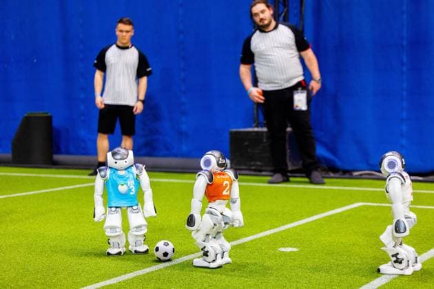 EINDHOVEN - Robot football during a practice day in the run-up to the World Cup for Robots: RoboCup 2024. Universities and technology companies from all over the world show what their robots can do in various disciplines. ANP IRIS VAN DEN BROEK netherlands out - belgium out  Copyright: xx x503648257x originalFilename: 503648257.jpg
