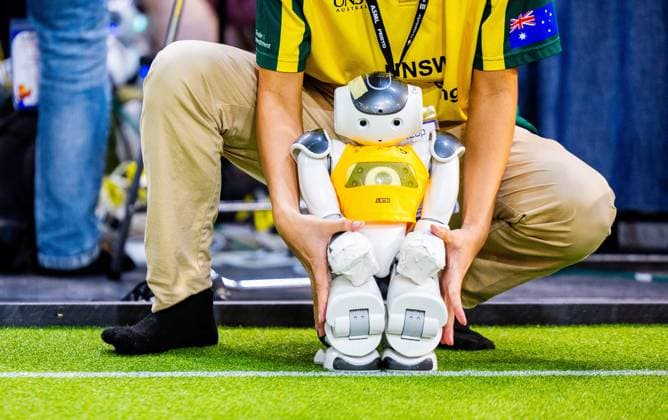 EINDHOVEN - Robot on the football field during a practice day in the run-up to the World Cup for Robots: RoboCup 2024. Universities and technology companies from all over the world show what their robots can do in various disciplines. ANP IRIS VAN DEN BROEK netherlands out - belgium out  Copyright: xx x503648358x originalFilename: 503648358.jpg