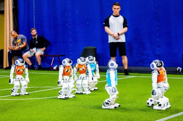 EINDHOVEN - Robot football during a practice day in the run-up to the World Cup for Robots: RoboCup 2024. Universities and technology companies from all over the world show what their robots can do in various disciplines. ANP IRIS VAN DEN BROEK netherlands out - belgium out  Copyright: xx x503648512x originalFilename: 503648512.jpg