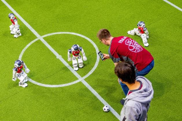 EINDHOVEN - Robot football during a practice day in the run-up to the World Cup for Robots: RoboCup 2024. Universities and technology companies from all over the world show what their robots can do in various disciplines. ANP IRIS VAN DEN BROEK netherlands out - belgium out  Copyright: xx x503649547x originalFilename: 503649547.jpg