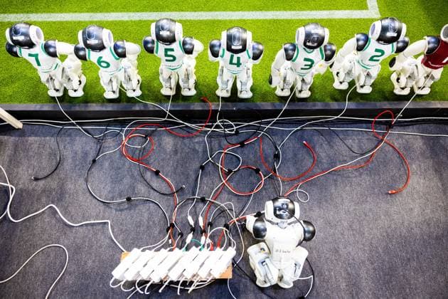 EINDHOVEN - Robot football team during a practice day in the run-up to the World Cup for Robots: RoboCup 2024. Universities and technology companies from all over the world show what their robots can do in various disciplines. ANP IRIS VAN DEN BROEK netherlands out - belgium out  Copyright: xx x503649988x originalFilename: 503649988.jpg