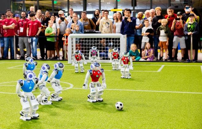 EINDHOVEN - Robot football during a practice day in the run-up to the World Cup for Robots: RoboCup 2024. Universities and technology companies from all over the world show what their robots can do in various disciplines. ANP IRIS VAN DEN BROEK netherlands out - belgium out  Copyright: xx x503650044x originalFilename: 503650044.jpg
