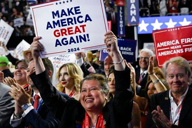 Delegates from New York wave signs during the 2024 Republican National Convention at Fiserv Forum in Milwaukee, Wisconsin on Thursday, July 18, 2024. The theme of the final day is Make America Great Once Again, with former President Donald Trump as the featured speaker.  MIL20240718313 MATTxMARTON