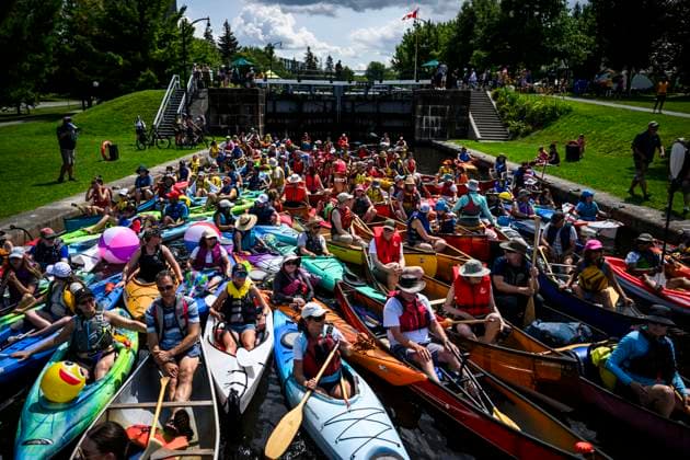 July 20, 2024, Ottawa, Canada: Paddlers wait to descend the locks at Hartwells Lockstation during Lock & Paddle 2024 on the Rideau Canal in Ottawa, on Saturday, July 20, 2024. A flotilla of canoes and kayaks descended and ascended the locks to celebrate Parks Day on the Rideau Canal, a UNESCO World Heritage site. Ottawa Canada  - ZUMAc35_ 20240720_zaf_c35_028 Copyright: xJustinxTangx