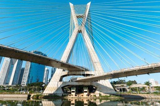 A view of the Octavio Frias de Oliveira Bridge in Sao Paulo, Brazil, with skyscrapers in the background and a clear blue sky. 24899875 RECORD DATE NOT STATED