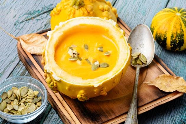 Autumn pumpkin soup in pumpkin. Autumn food.Cream soup in pumpkin. Pumpkin cream soup in pumpkin ,model released, Symbolfoto