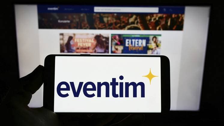 Stuttgart, Germany, 05 21 2022 Person Holding cellphone With Logo of German Ticketing Company CTS Eventim AG Co KGaA ON Screen in Front of webpage Focus ON Phone display, Europe Copyright: imageBROKER TimonxSchneider ibliqx10688297.jpg