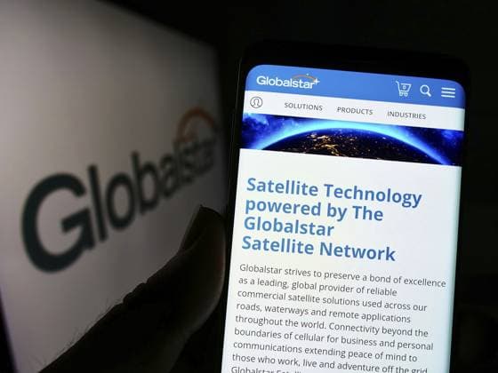 Stuttgart, Germany, 09-10-2022: Person holding cellphone with webpage of satellite communications company Globalstar Inc. on screen with logo. Focus on center of phone display, Europe *** Stuttgart, Germany, 09 10 2022 Person Holding cellphone With webpage of Satellite Communications Company Global Star INC ON Screen With Logo Focus ON Center of Phone display, Europe Copyright: imageBROKER TimonxSchneider ibliqx10696745.jpg