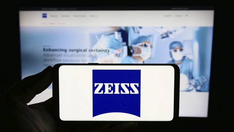 Stuttgart, Germany, 09-17-2023: Person holding smartphone with logo of medical technology company Carl Zeiss Meditec AG on screen in front of website. Focus on phone display, Europe Copyright: imageBROKER TimonxSchneider ibliqx10723685.jpg