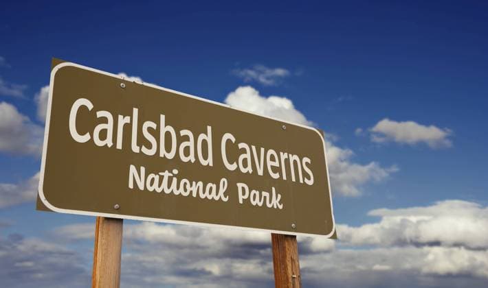 Carlsbad caverns national park (new Mexico) road sign against blue sky and clouds Copyright: imageBROKER AndyxDean ibxdea11052920.jpg