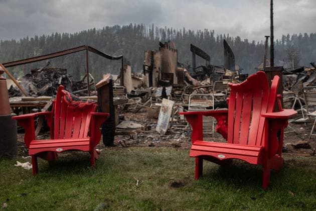 July 26, 2024, Jasper, Ab, CANADA: Melted chairs are shown outside of the burned Maligne Lodge after wildfires encroached into Jasper, Alta., on Friday, July 26, 2024. Wildfires encroaching into the townsite of Jasper forced an evacuation of the national park and have destroyed over 300 of the town s approximately 1100 structures, mainly impacting residential areas. Jasper CANADA  - ZUMAc35_ 20240726_zaf_c35_133 Copyright: xAmberxBrackenx
