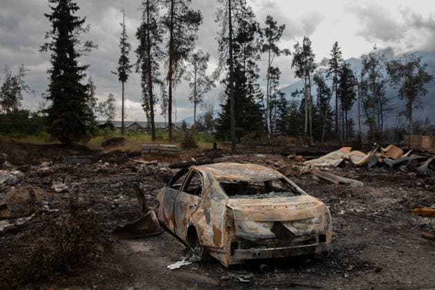 July 26, 2024, Jasper, Ab, CANADA: A burnt car in a devastated residential block in Jasper, Alta., on Friday July 26, 2024. Wildfires encroaching into the townsite of Jasper forced an evacuation of the national park and have destroyed over 300 of the town s approximately 1100 structures, mainly impacting residential areas. Jasper CANADA  - ZUMAc35_ 20240726_zaf_c35_162 Copyright: xAmberxBrackenx