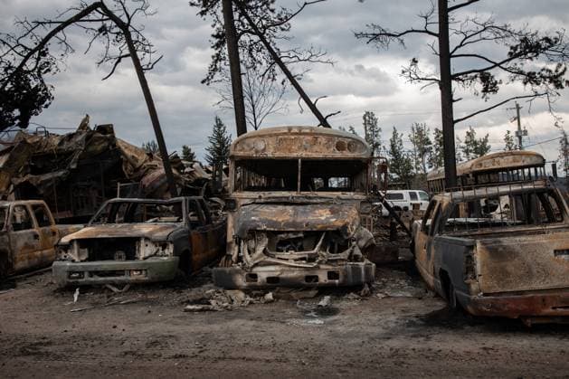 July 26, 2024, Jasper, Ab, CANADA: Burnt buses and cars in Jasper, Alta., on Friday, July 26, 2024. Wildfires encroaching into the townsite of Jasper forced an evacuation of the national park and have destroyed over 300 of the town s approximately 1100 structures, mainly impacting residential areas. Jasper CANADA  - ZUMAc35_ 20240726_zaf_c35_229 Copyright: xAmberxBrackenx