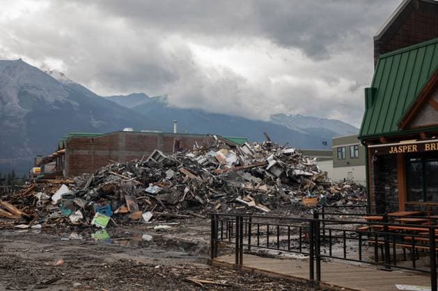 July 26, 2024, Jasper, Ab, CANADA: Demolished structures in downtown Jasper, Alta., on Friday, July 26, 2024. Wildfires encroaching into the townsite of Jasper forced an evacuation of the national park and have destroyed over 300 of the town s approximately 1100 structures, mainly impacting residential areas. Jasper CANADA  - ZUMAc35_ 20240726_zaf_c35_232 Copyright: xAmberxBrackenx