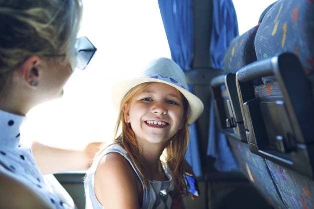 Creative Highlights Symbolbilder Side view of young female in casual wear holding little daughter and together while having bus trip in sunny summer day Copyright: imageBROKER DashaxPetrenko ibxiqx10540106.jpg ,model released, Symbolfoto ,property released