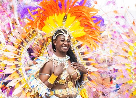 (240804) -- TORONTO, Aug. 4, 2024 -- A dressed-up reveler takes part in the Grand Parade of the 2024 Toronto Caribbean Carnival in Toronto, Canada, Aug. 3, 2024. The annual event was held here on Saturday to showcase Caribbean culture. (Photo by Zou Zheng Xinhua) CANADA-TORONTO-CARIBBEAN CARNIVAL-GRAND PARADE LinxWei 