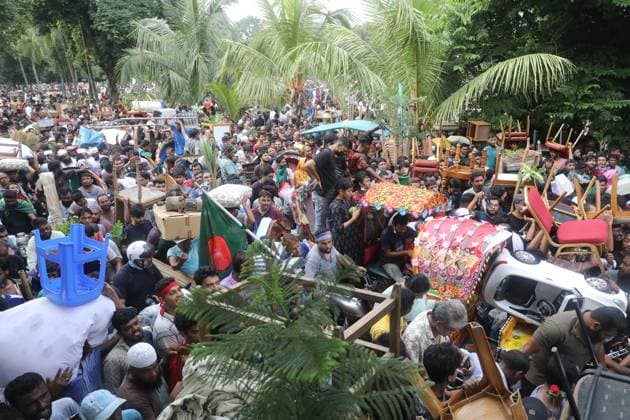 August 5, 2024, Dhaka, Wari, Bangladesh: Anti-government protestors celebrate in Shahbag near Dhaka university area in Dhaka on August 5, 2024. Protests in Bangladesh that began as student-led demonstrations against government hiring rules in July culminated on August 5, in the prime minister fleeing and the military announcing it would form an interim government.People gather to celebrate the fall of Bangladesh Prime Minister Sheikh Hasina after an intense clash between police, pro-government forces, and anti-Quota protesters in Dhaka, Bangladesh. Dhaka Bangladesh - ZUMAr336 20240805_zip_r336_016 Copyright: xHabiburxRahmanx