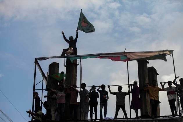 August 5, 2024, Dhaka, Dhaka, Bangladesh: Anti-government protestors celebrate in Dhaka on August 5, 2024. Protests in Bangladesh that began as student-led demonstrations against government hiring rules in July culminated on August 5, in the prime minister fleeing and the military announcing it would form an interim government. Dhaka Bangladesh - ZUMAj163 20240805_zip_j163_013 Copyright: xAbuxSufianxJewelx
