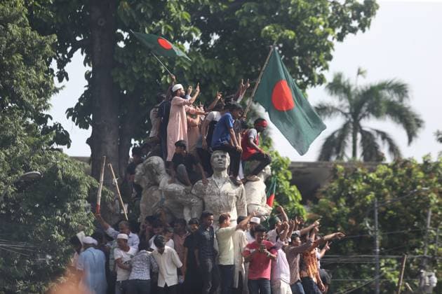 August 5, 2024, Dhaka, Wari, Bangladesh: Anti-government protestors celebrate in Shahbag near Dhaka university area in Dhaka on August 5, 2024. Protests in Bangladesh that began as student-led demonstrations against government hiring rules in July culminated on August 5, in the prime minister fleeing and the military announcing it would form an interim government.People gather to celebrate the fall of Bangladesh Prime Minister Sheikh Hasina after an intense clash between police, pro-government forces, and anti-Quota protesters in Dhaka, Bangladesh. Dhaka Bangladesh - ZUMAr336 20240805_zip_r336_064 Copyright: xHabiburxRahmanx
