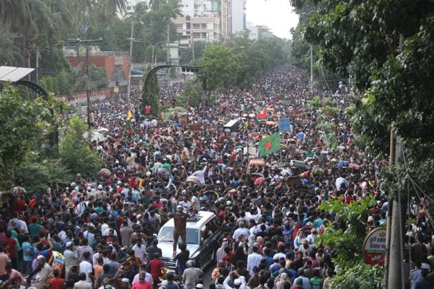 August 5, 2024, Dhaka, Wari, Bangladesh: Anti-government protestors celebrate in Shahbag near Dhaka university area in Dhaka on August 5, 2024. Protests in Bangladesh that began as student-led demonstrations against government hiring rules in July culminated on August 5, in the prime minister fleeing and the military announcing it would form an interim government.People gather to celebrate the fall of Bangladesh Prime Minister Sheikh Hasina after an intense clash between police, pro-government forces, and anti-Quota protesters in Dhaka, Bangladesh. Dhaka Bangladesh - ZUMAr336 20240805_zip_r336_068 Copyright: xHabiburxRahmanx