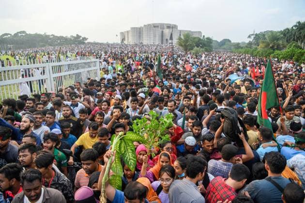 August 5, 2024, Dhaka, Bangladesh: Anti-government protestors gather at the parliament house during the celebrations. Thousands of People celebrate the resignation of Bangladeshi Prime Minister Sheikh Hasina. Protests in Bangladesh that began as student-led demonstrations against government hiring rules in July culminated on August 5, in the Prime Minister fleeing and the military announcing it would form an interim government. Dhaka Bangladesh - ZUMAs197 20240805_aaa_s197_097 Copyright: xPiyasxBiswasx