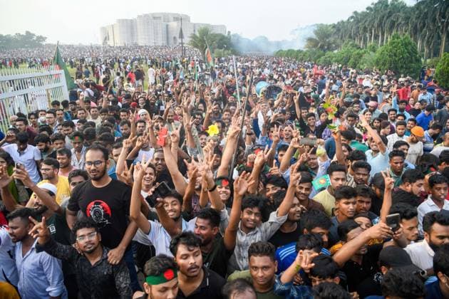 August 5, 2024, Dhaka, Bangladesh: Anti-government protestors gather at the parliament house during the celebrations. Thousands of People celebrate the resignation of Bangladeshi Prime Minister Sheikh Hasina. Protests in Bangladesh that began as student-led demonstrations against government hiring rules in July culminated on August 5, in the Prime Minister fleeing and the military announcing it would form an interim government. Dhaka Bangladesh - ZUMAs197 20240805_aaa_s197_102 Copyright: xPiyasxBiswasx