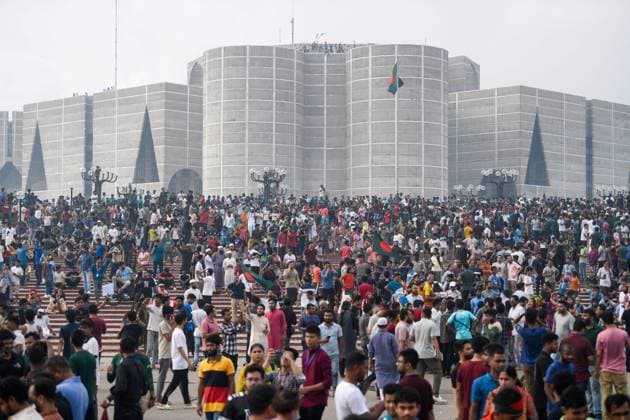 August 5, 2024, Dhaka, Bangladesh: Anti-government protestors gather at the parliament house during the celebrations. Thousands of People celebrate the resignation of Bangladeshi Prime Minister Sheikh Hasina. Protests in Bangladesh that began as student-led demonstrations against government hiring rules in July culminated on August 5, in the Prime Minister fleeing and the military announcing it would form an interim government. Dhaka Bangladesh - ZUMAs197 20240805_aaa_s197_104 Copyright: xPiyasxBiswasx