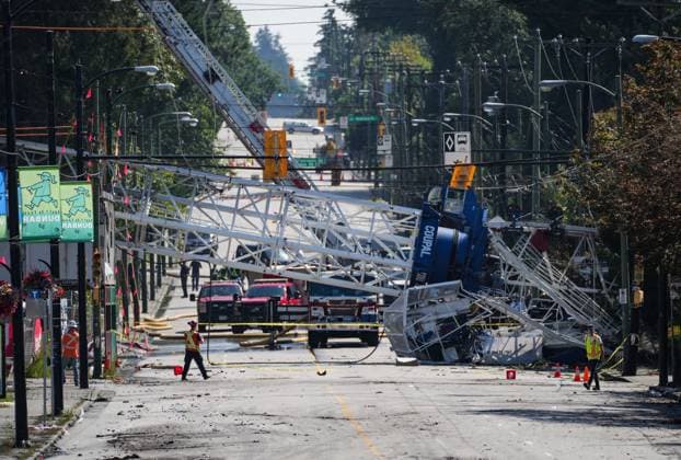 August 7, 2024, Vancouver, Bc, CANADA: A crane that collapsed during a fire at an apartment building under construction on Tuesday lies across the road, in Vancouver, on Wednesday, August 7, 2024. The fire destroyed the building under construction and damaged nine other nearby homes. Vancouver CANADA  - ZUMAc35_ 20240807_zaf_c35_159 Copyright: xDarrylxDyckx