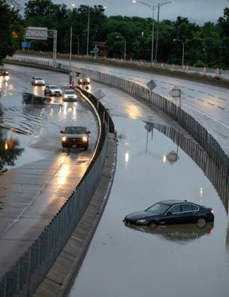 August 9, 2024, Montreal, Pq, CANADA: Cars drive slowly through water overflowing on to highway 40 in Sainte-Anne-de-Bellevue on the Island of Montreal after heavy rains hit the area on Friday, August 9, 2024. Montreal CANADA  - ZUMAc35_ 20240809_zaf_c35_185 Copyright: xPeterxMccabex