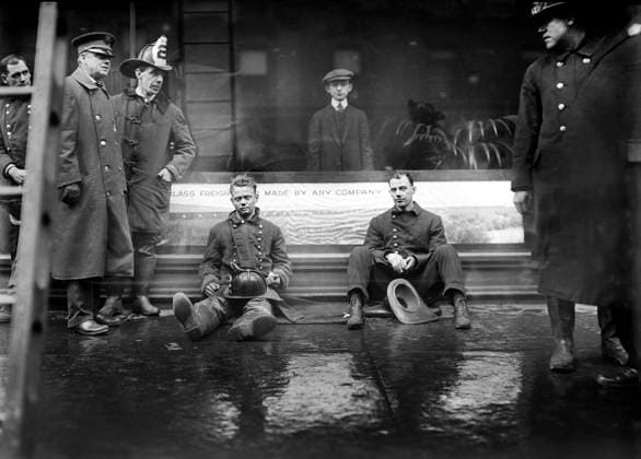 Firemen seated on sidewalk after fighting subway tunnel fire, West 55th Street and Broadway, New York City, New York, USA, Bain News Service, January 1915  Copyright: xCircaxImagesx ghi-circa02845