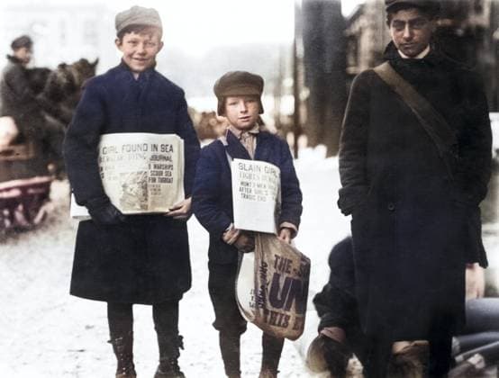 Three newsboys selling newspapers in winter, Schenectady, New York, USA, Lewis Hine for National Child Labor Committee, February 1910  Copyright: xCircaxImagesx ghi-circa04353