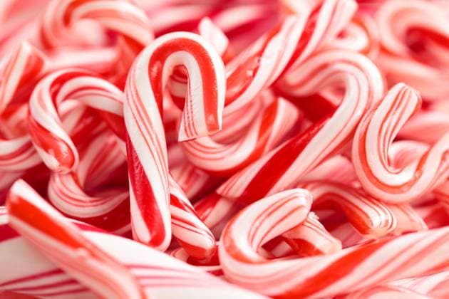 Candy Cane Background. Festive red and white peppermint candycanes background. Shallow dof. Copyright: xZoonar.com VitalinaxRybakovax 7879329