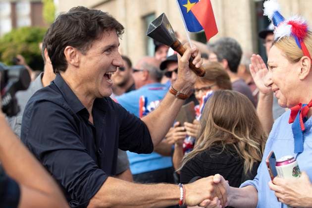 August 15, 2024, Yarmouth, Ns, Canada: Prime Minister Justin Trudeau greets people in the crowd during the Tintamarre Parade in Yarmouth, N.S., on Thursday, August 15, 2024. Yarmouth Canada  - ZUMAc35_ 20240815_zaf_c35_061 Copyright: xRonxWardx