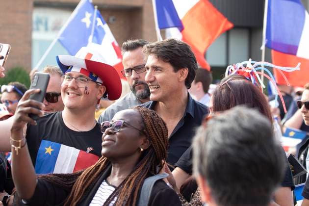 August 15, 2024, Yarmouth, Ns, Canada: Prime Minister Justin Trudeau stops for a selfie during the Tintamarre Parade in Yarmouth, N.S., on Thursday, August 15, 2024. Yarmouth Canada  - ZUMAc35_ 20240815_zaf_c35_063 Copyright: xRonxWardx