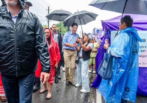 August 17, 2024, Toronto, On, Canada: Prime Minister Justin Trudeau greets people as rain falls at the Taste of Manila festival in Toronto on Saturday, August 17, 2024. Toronto Canada  - ZUMAc35_ 20240817_zaf_c35_022 Copyright: xLauraxProctorx