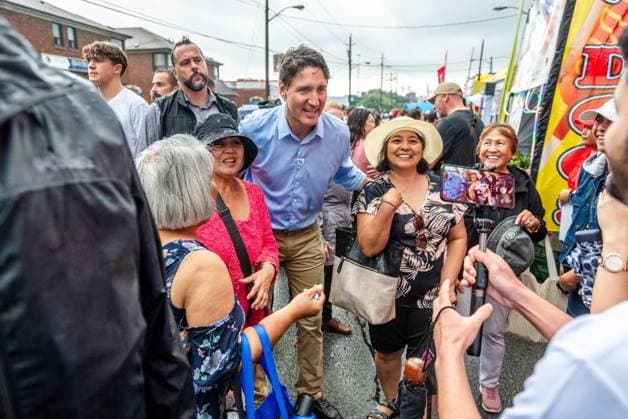 August 17, 2024, Toronto, On, Canada: Prime Minister Justin Trudeau greets people in the rain at the Taste of Manila festival in Toronto on Saturday, August 17, 2024. Toronto Canada  - ZUMAc35_ 20240817_zaf_c35_038 Copyright: xLauraxProctorx