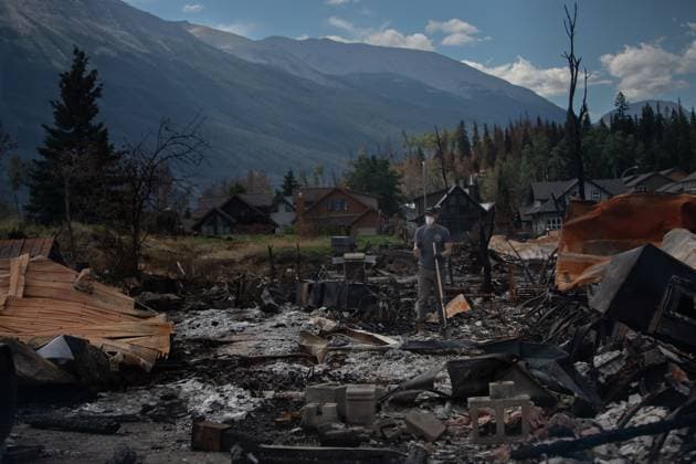 August 19, 2024, Jasper, Ab, CANADA: A homeowner digs in the ashes of their home as some return to Jasper, Alberta on Monday August 19, 2024. Wildfire caused evacuations and widespread damage in the National Park and Jasper townsite. The resident consented to be photographed but declined to give his name because there was conflicting instructions for residents access to their properties and he didn t want to get in trouble. Jasper CANADA  - ZUMAc35_ 20240819_zaf_c35_064 Copyright: xAmberxBrackenx
