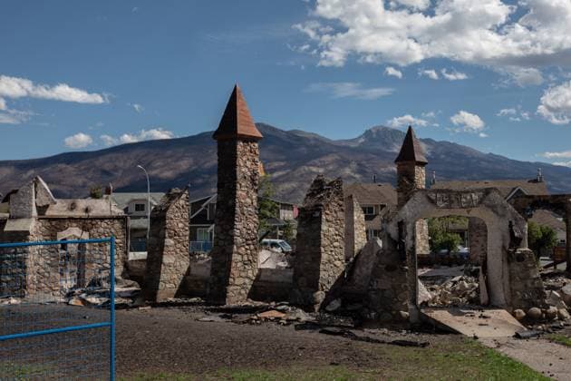 August 19, 2024, Jasper, Ab, CANADA: The burnt remains of the historical Anglican Church seen in Jasper, Alberta on Monday August 19, 2024. Wildfire caused evacuations and widespread damage in the National Park and Jasper townsite. Jasper CANADA  - ZUMAc35_ 20240819_zaf_c35_076 Copyright: xAmberxBrackenx