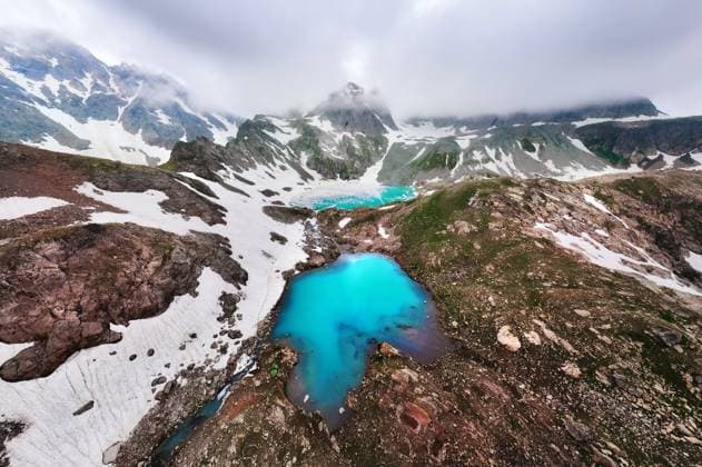 Creative Highlights World Wide-angle aerial view of high mountain lakes surrounded by snow-covered rocks. Crazy view of two turquoise mountain lakes. Sources of clean water high in the mountains Wide-angle aerial view of high mountain lakes surrounded by snow-covered rocks. Crazy view of two turquoise mountain lakes. Sources of clean water high in the mountains. Copyright: xZoonar.com IanxIankovskiix 22035576