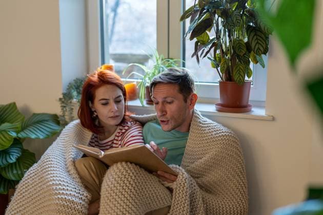 Young family couple man and woman discussing new book while reading together at home Young family couple man and woman discussing new book while reading together at home, having common interests. Hobbies for couples and intellectual intimacy in relationships concept ,model released, Symbolfoto Copyright: xZoonar.com DmitriixMarchenkox 22051378 ,model released, Symbolfoto ,property released