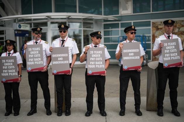 August 27, 2024, Richmond, Bc, CANADA: Air Canada pilots hold signs during an informational picket at Vancouver International Airport in Richmond, B.C., on Tuesday, August 27, 2024. Air Canada pilots voted overwhelmingly to approve a strike mandate last week, putting them in a position to walk off the job as early as Sept. 17. The Air Line Pilots Association, which represents more than 5,400 aviators at the country s largest carrier, said the vote passed with 98 per cent support. Richmond CANADA - ZUMAc35_ 20240827_zaf_c35_026 Copyright: xDarrylxDyckx