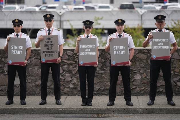 August 27, 2024, Richmond, Bc, CANADA: Air Canada pilots hold signs during an informational picket at Vancouver International Airport in Richmond, B.C., on Tuesday, August 27, 2024. Air Canada pilots voted overwhelmingly to approve a strike mandate last week, putting them in a position to walk off the job as early as Sept. 17. The Air Line Pilots Association, which represents more than 5,400 aviators at the country s largest carrier, said the vote passed with 98 per cent support. Richmond CANADA - ZUMAc35_ 20240827_zaf_c35_032 Copyright: xDarrylxDyckx