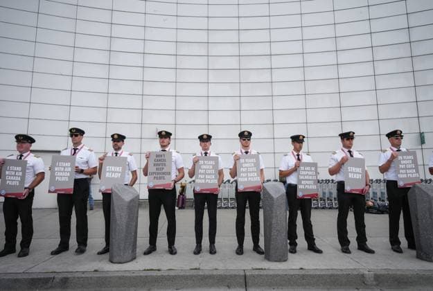 August 27, 2024, Richmond, Bc, CANADA: Air Canada pilots hold signs during an informational picket at Vancouver International Airport in Richmond, B.C., on Tuesday, August 27, 2024. Air Canada pilots voted overwhelmingly to approve a strike mandate last week, putting them in a position to walk off the job as early as Sept. 17. The Air Line Pilots Association, which represents more than 5,400 aviators at the country s largest carrier, said the vote passed with 98 per cent support. Richmond CANADA - ZUMAc35_ 20240827_zaf_c35_037 Copyright: xDarrylxDyckx