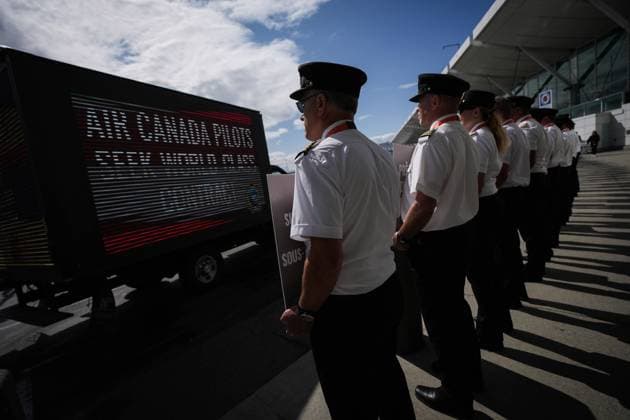 August 27, 2024, Richmond, Bc, CANADA: Air Canada pilots stand during an informational picket at Vancouver International Airport in Richmond, B.C., on Tuesday, August 27, 2024. Air Canada pilots voted overwhelmingly to approve a strike mandate last week, putting them in a position to walk off the job as early as Sept. 17. The Air Line Pilots Association, which represents more than 5,400 aviators at the country s largest carrier, said the vote passed with 98 per cent support. Richmond CANADA - ZUMAc35_ 20240827_zaf_c35_040 Copyright: xDarrylxDyckx