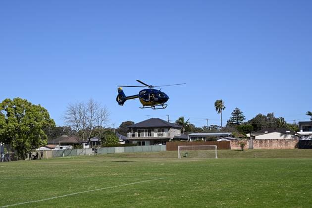 SYDNEY SOCCER DEATH, a Careflight Helicopter arrives after a man collapsed during the Granville Football Association Grand Final Day at Binalong Park, Toongabbie, NSW, Saturday, August 31, 2024. A man has died during a local soccer grand final, leading to the cancellation of other games as the community mourns. ( NO ARCHIVING, EDITORIAL USE ONLY, NO USE IN BOOKS WITHOUT CONSENT SYDNEY NEW SOUTH WALES AUSTRALIA Sydney  Copyright: xSTEVENxMARKHAMx 20240831180977303856
