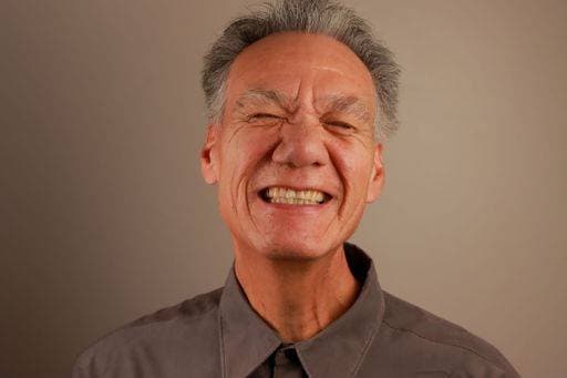Creative Highlights Symbolbilder A portrait of a senior Hispanic man smiling against a neutral background 25467858 ,model released, Symbolfoto RECORD DATE NOT STATED