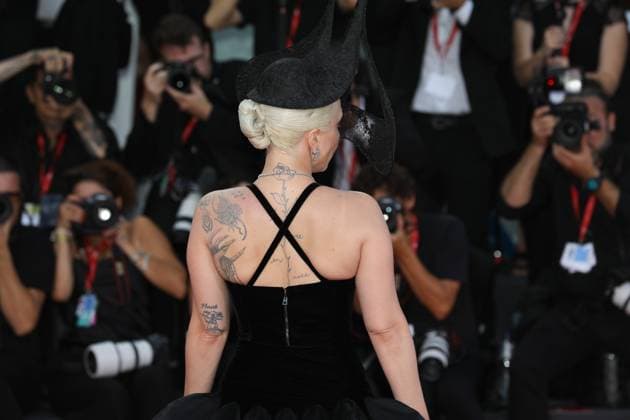 September 4, 2024, Lido Di Venezia, Veneto, Italy: Tatooes on LADY GAGA s back are visible as she walks the red carpet for the Premiere of Joker: Folie a Deux movie during the 81st Venice International Film Festival in Lido di Venezia, Italy Lido Di Venezia Italy - ZUMAc179 20240904_zep_c179_156 Copyright: xMickaelxChavetx