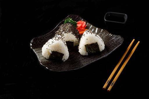 onigiri three balls or triangles of rice on black background japanese food 25737722 RECORD DATE NOT STATED