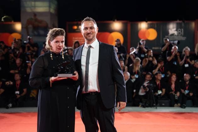 2024 Winners Photocall - The 81st Venice International Film Festival Marco Valerio Fusco and Dorothe Beinemeier pose with the Horizons Best Screenplay Award during the 81st Venice International Film Festival at Palazzo del Cinema in Venice, Italy, on September 7, 2024. Venice Italy  Copyright: xLucaxCarlinox originalFilename: carlino-notitle240907_npkWb.jpg